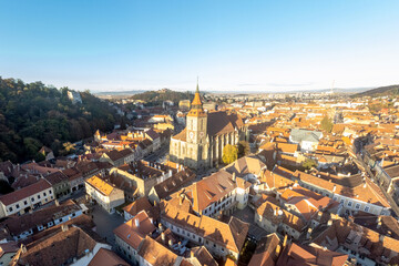 Black Church in Old Town city center, Brasov, Transylvania, Romania. Aerial view at sunset. 