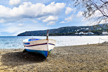 Typical fishing boat on the beach of the picturesque coastal town of Cadaques, Costa Brava, Girona