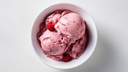 An overhead shot captures raspberry ice cream in a white bowl, tempting the viewer with its delicious presentation.