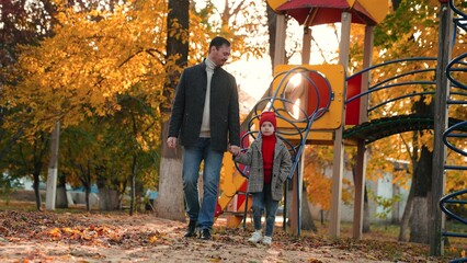 Daughter and dad decide to explore hidden paths of park. Daughter talks about favourite autumn...
