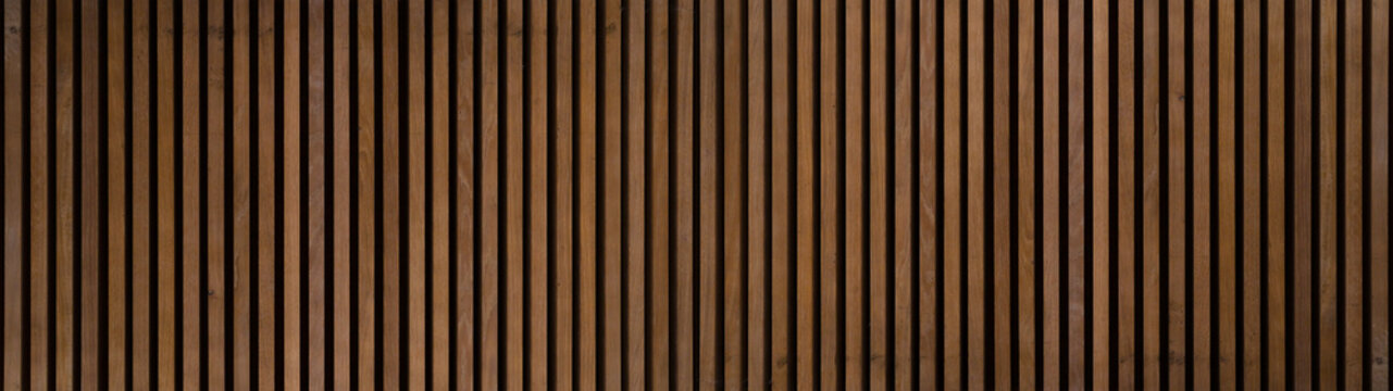 Wood background banner panorama long - Brown wooden acoustic panels wall texture , seamless pattern..