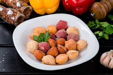 Different taste fried dumplings with meat, sweet pepper, herbs and spices.