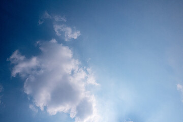 blue sky with white clouds sunray background