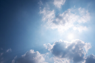 Naklejka na ściany i meble blue sky with white clouds sunray background