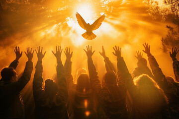 Crowd of people raising hands worshiping the Holy Spirit flying over the crowd of believers - obrazy, fototapety, plakaty