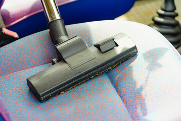 Cleaning car interior with vacuum cleaner