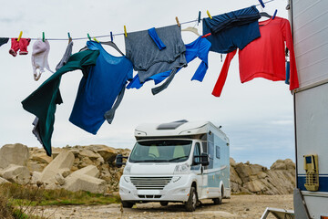 Washing laundry hanging to dry outdoors at caravan - obrazy, fototapety, plakaty
