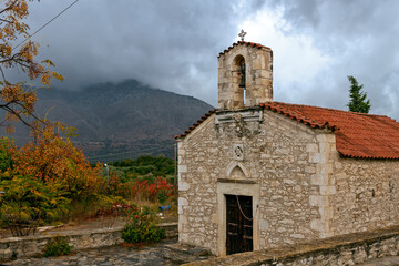 Old stone-built Greek orthodox christian church in the countryside of Crete island, Greece, during...