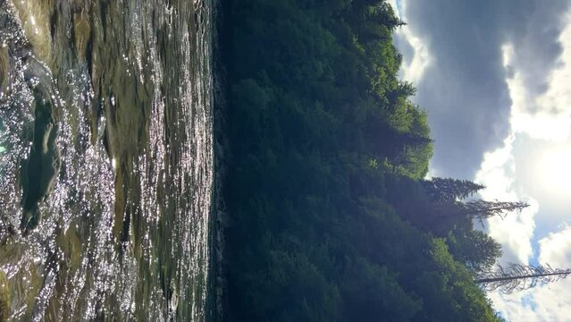 The Bolshaya Laba River. A mountain emerald river in a narrow, sunlit canyon. Bolshaya Laba River near the village of Psemen in Karachay-Cherkessia, Russia. Panoramic view. 4K