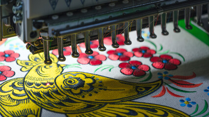 Machine embroidery close-up. Floral pattern as industrial concept - 750152133
