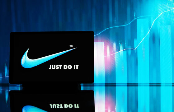 In this photo illustration,  Nike, Inc.  logo seen displayed on a tablet