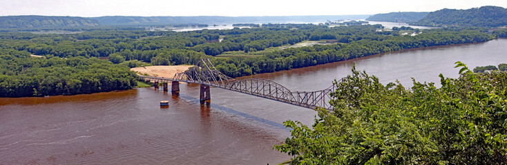 The Black Hawk Bridge spans the Mississippi River, joining Lansing IA, to WI. A riveted iron truss bridge built in 1931 from a scenic overlook mount Hosmer.