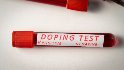 Doping Test, Inscription doping test with positive result. Tubes with athlete's blood taken for...