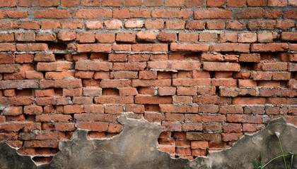 Fragment of old brickwork, close-up. Red brick wall. Potholes and defects in a brick wall. Flat...