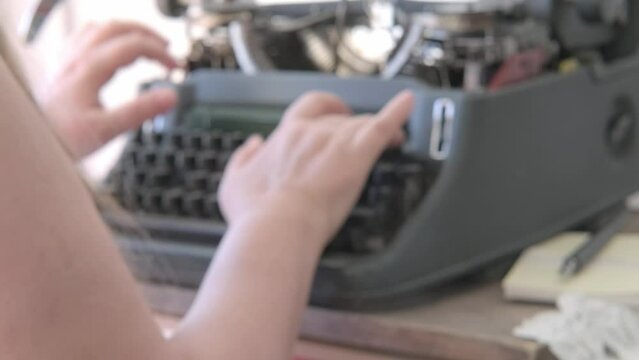 Female hands typing text on vintage typewriter, creative process and literary creation concept, atmosphere journalism and reportage, women's role in tech industry