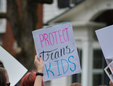 "Protect Tarns Kids" sign.