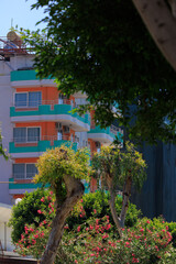 View of buildings and houses in public places in Turkey, sunny summer day