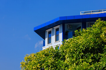 View of buildings and houses in public places in Turkey, sunny summer day