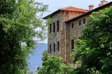 View of buildings and houses in public places in Turkey, sunny summer day