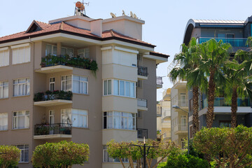 View of buildings and houses in public places in Turkey, sunny summer day