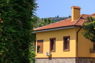 View of buildings and houses in public places in Turkey, sunny summer day
