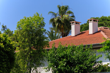 View of buildings and houses in public places in Turkey, sunny summer day