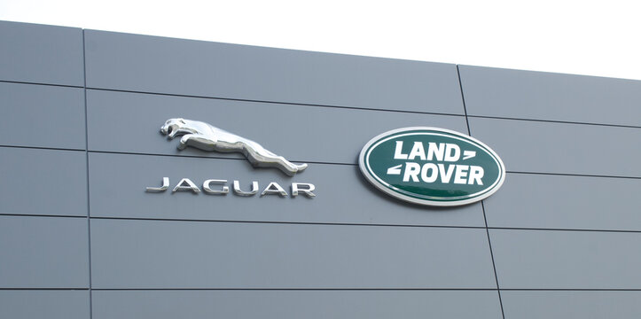OCALA, FLORIDA USA - OCTOBER 22, 2023  Land Rover dealership with green oval logo on front of building with sky background. Jaguar Land Rover Limited is a British multinational automotive company.