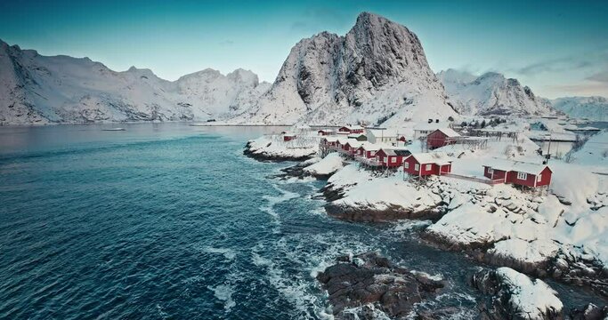 Winter aerial fjord panorama landscape of picturesque Reine fishing village, sea and snowy mountains hills, Lofoten islands, Norway
