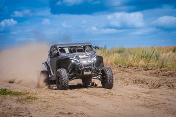 UTV in action offroad vehicle racing on sand dune. Extreme, adrenalin. 4x4.