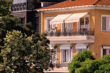 Fototapeta na wymiar View of buildings and houses in public places in Turkey, sunny summer day