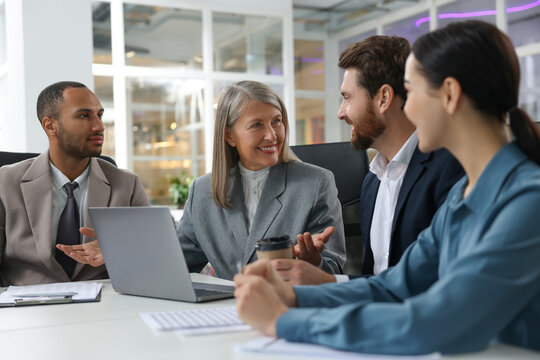 Lawyers working together at table in office