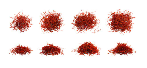 Piles of aromatic saffron isolated on white, top and side views