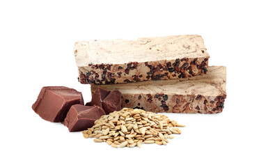 Tasty halva, pieces of chocolate and peeled sunflower seeds isolated on white