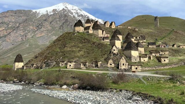 Dargavs is a unique city of the dead in North Ossetia. There are many houses and a crypt-tomb on the top of the rocky mountains. The City of the Dead on the mountainside near the Midagrabindon River. 