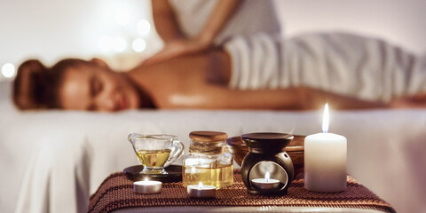 Relaxed woman enjoying aromatherapy massage in luxury spa
