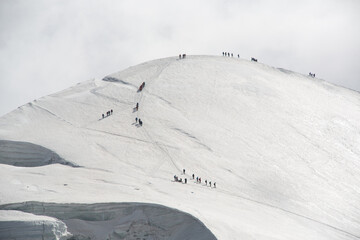 Climbers walking up a mountain near Zermatt and Matterhorn
