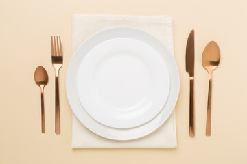 Minimal table setting on color background, top view