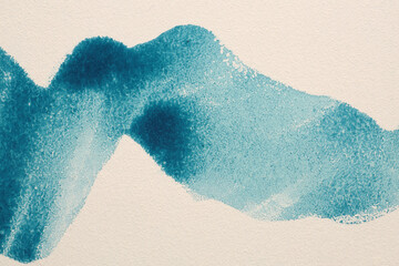 Ink watercolor hand drawn pour flow painting smear brushstroke blot. Wave blue beige wall texture background.