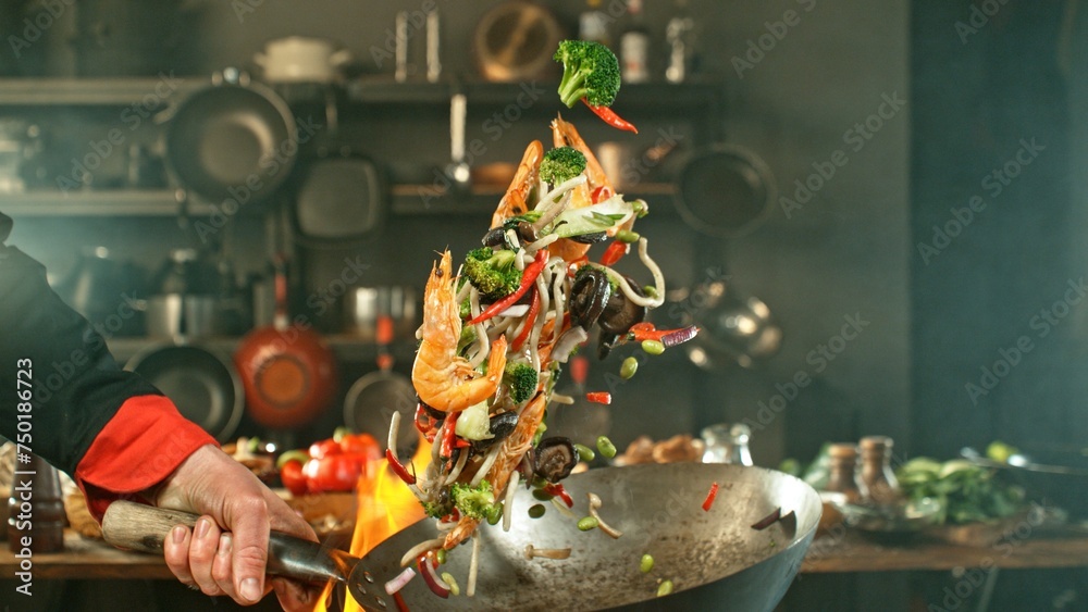 Wall mural freeze motion of wok pan with flying asian meal in the air. - Wall murals