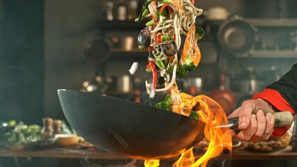 Freeze Motion of Wok Pan with Flying Asian Meal in the Air. - 750186704