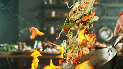 Freeze Motion of Wok Pan with Flying Asian Meal in the Air. - 750186714
