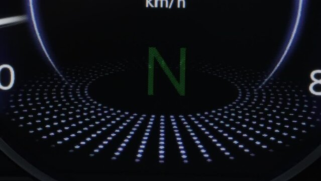 Car dashboard close up. Shifting automatic transmission from P parking to D drive mode. Driver In Auto Gear Lever Drive Mode. Driver Driving SUV Automobile Stick Shift Transmission.
