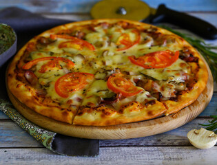 Pizza with mushrooms, cheese and tomatoes 