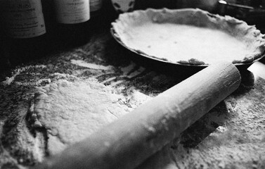 making a homemade pie dough in the kitchen in black and white