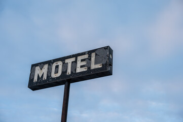 Decaying motel sign in an abandoned old hotel.