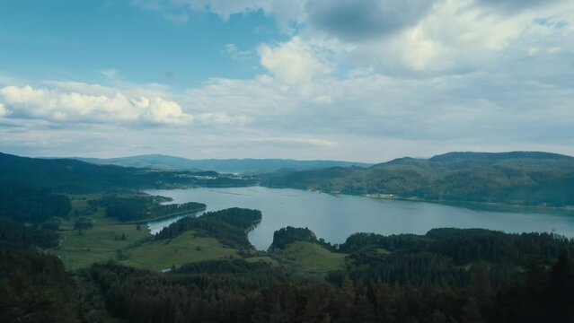 Panoramic aerial view of a lake in the mountain on a cloudy summer day, Rhodope Bulgaria