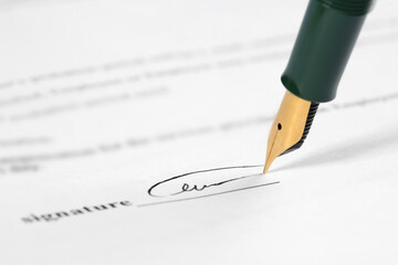 Signing notary document with fountain pen, closeup. Space for text