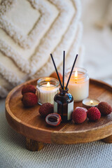 Fruity litchee aroma reed home diffuser on wooden table. Aromatherapy, relaxation, detention....