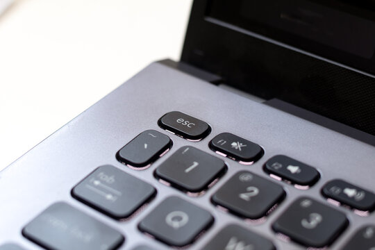 Close up of laptop computer keyboard, focus on the escape button
