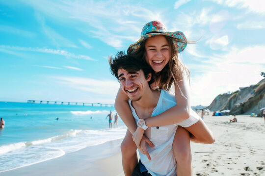 Joyful beach day piggyback ride. The woman is playfully piggybacking on the man's back. Concept of youthful love and carefree relaxation by the sea.